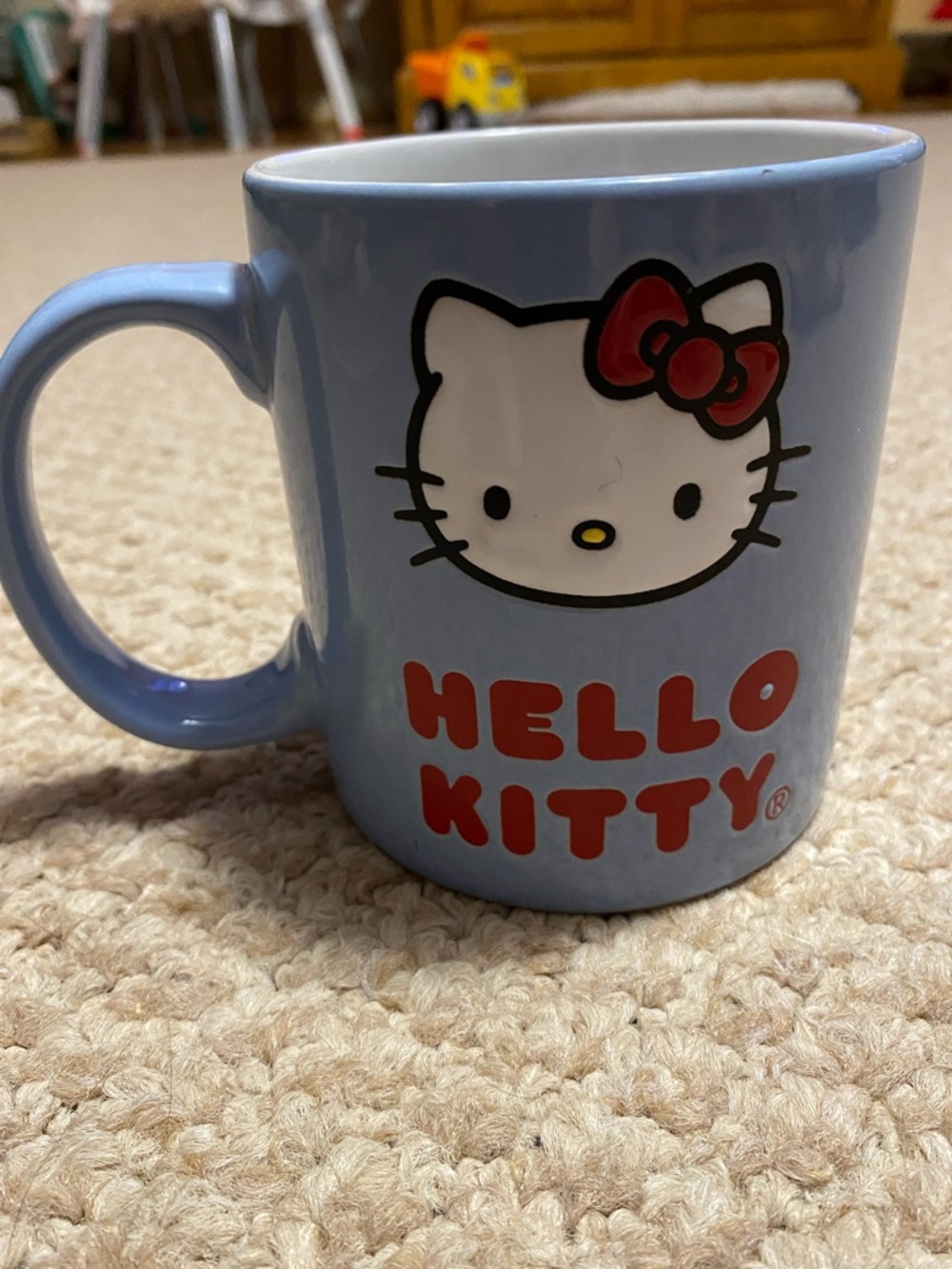 Sanrio Hello Kitty engraved images Light Blue coffee tea mug with Red Accents